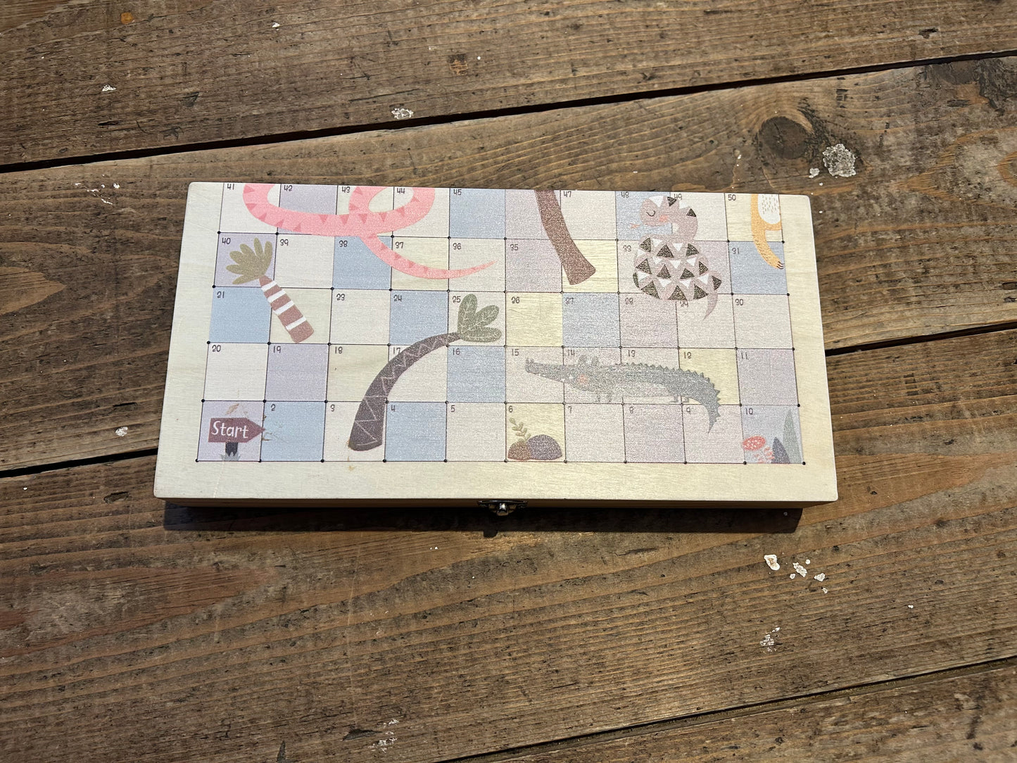 Wooden snake and ladders game