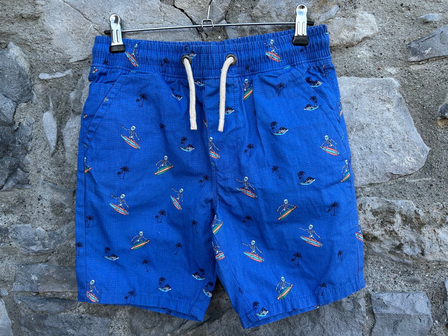 Surfing skeletons blue shorts 12y (152cm)