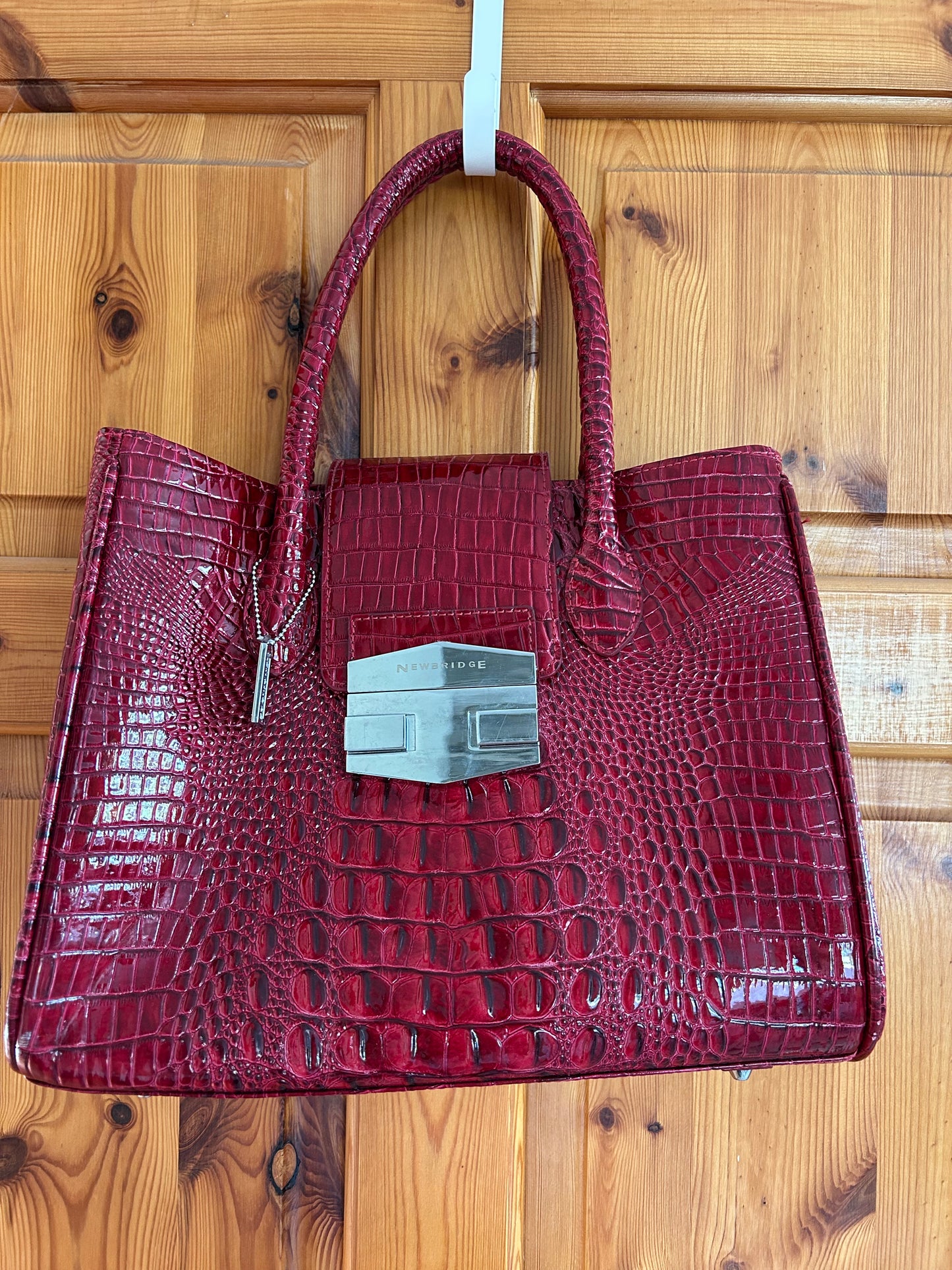 Red crocodile style handbag