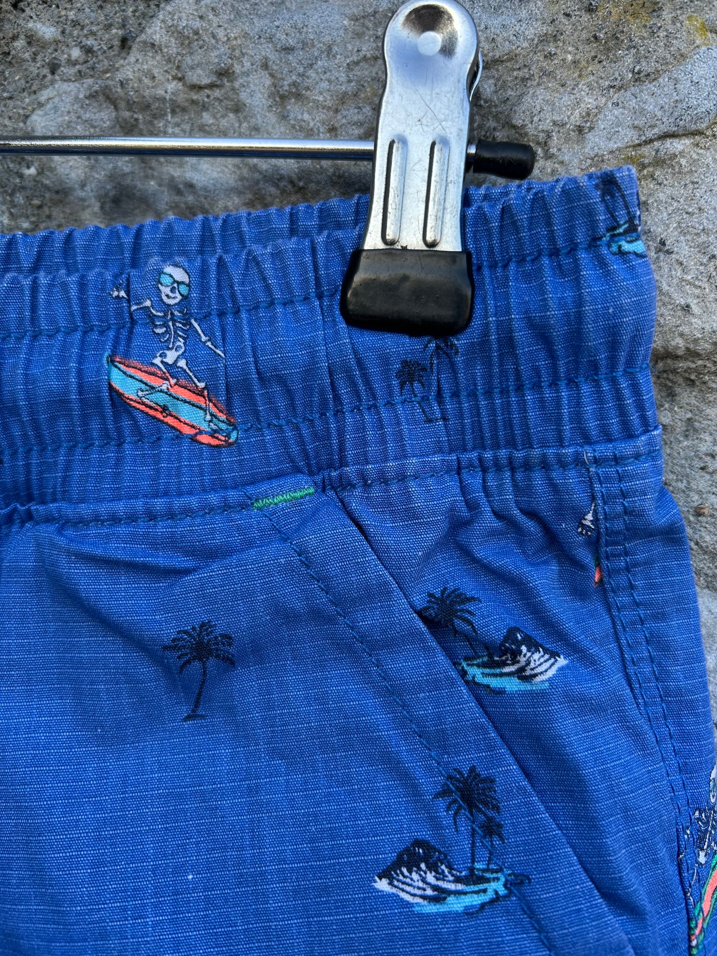 Surfing skeletons blue shorts 12y (152cm)