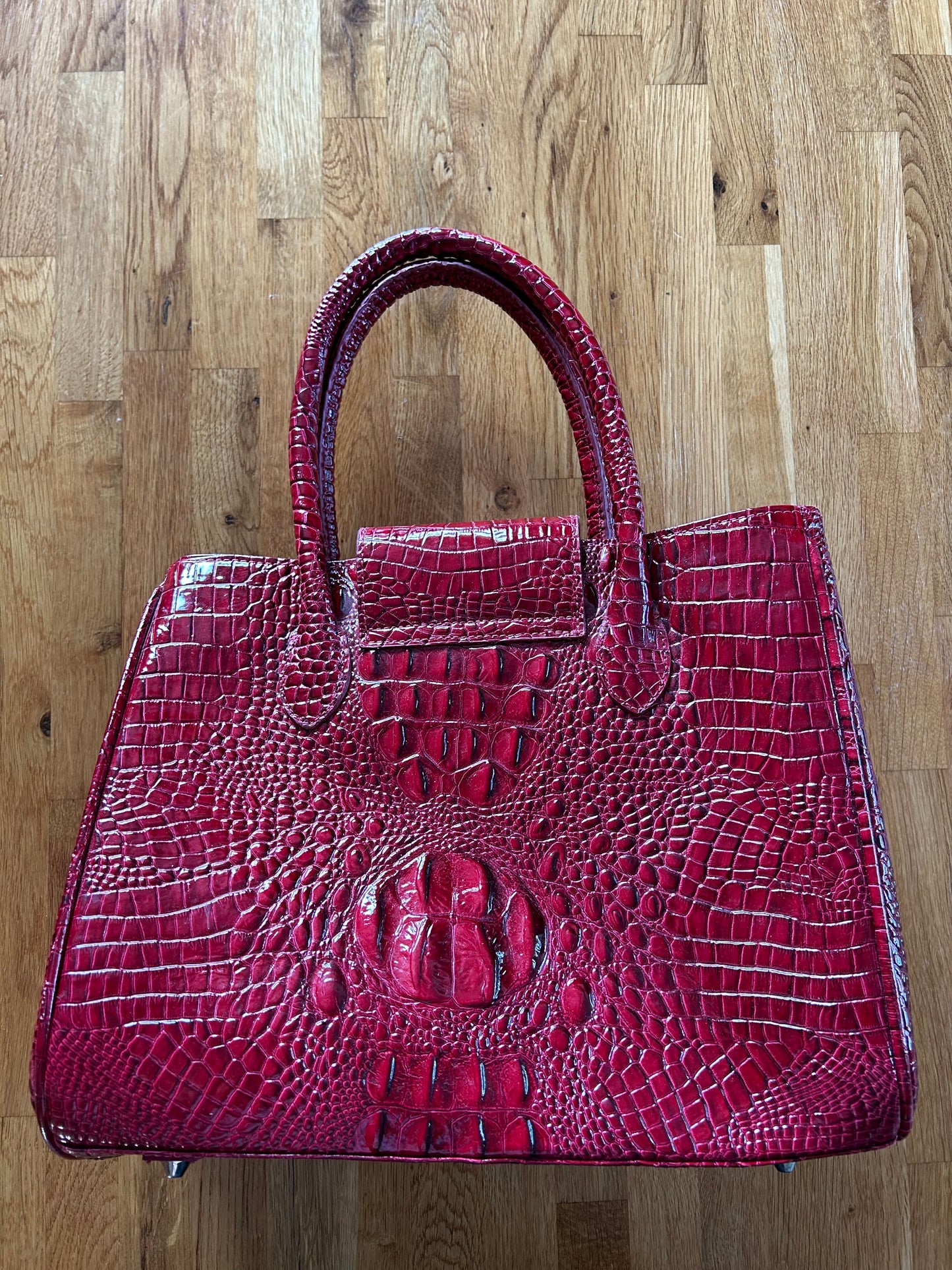 Red crocodile style handbag