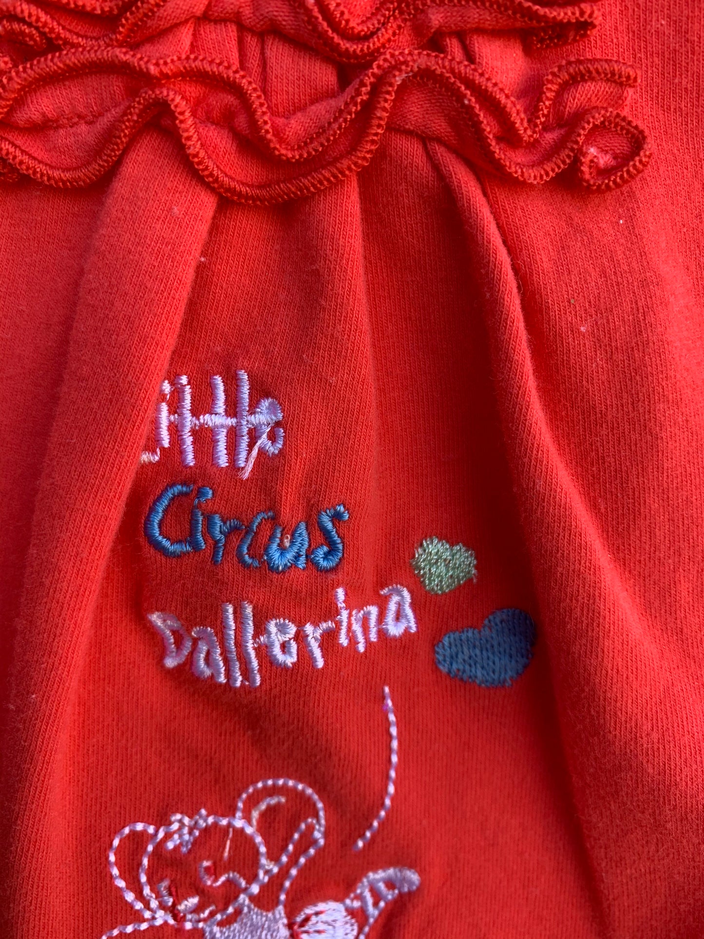 Red pinafore 0-3m (56-62cm)