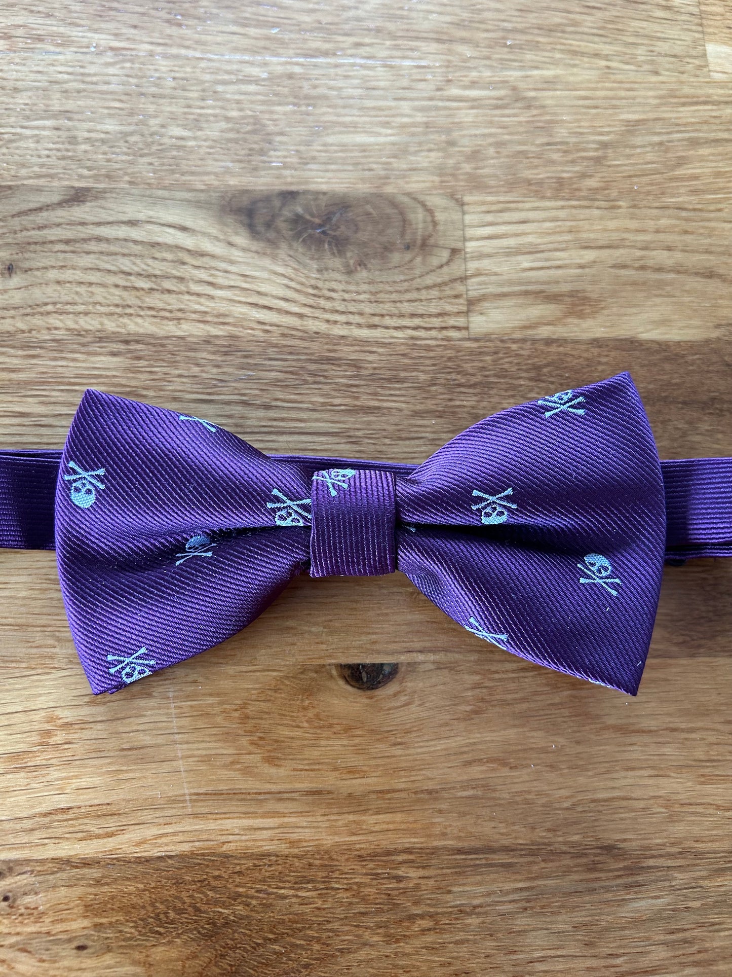 Purple skull bow tie