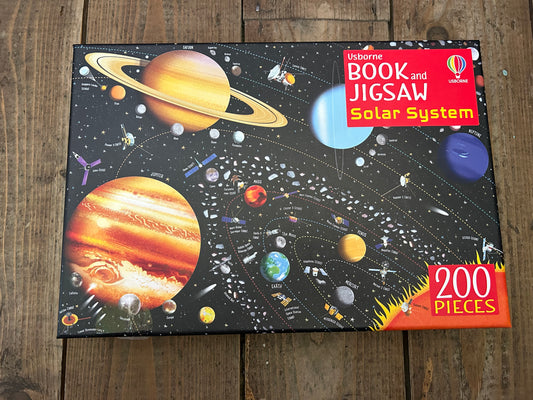 Book and jigsaw solar system