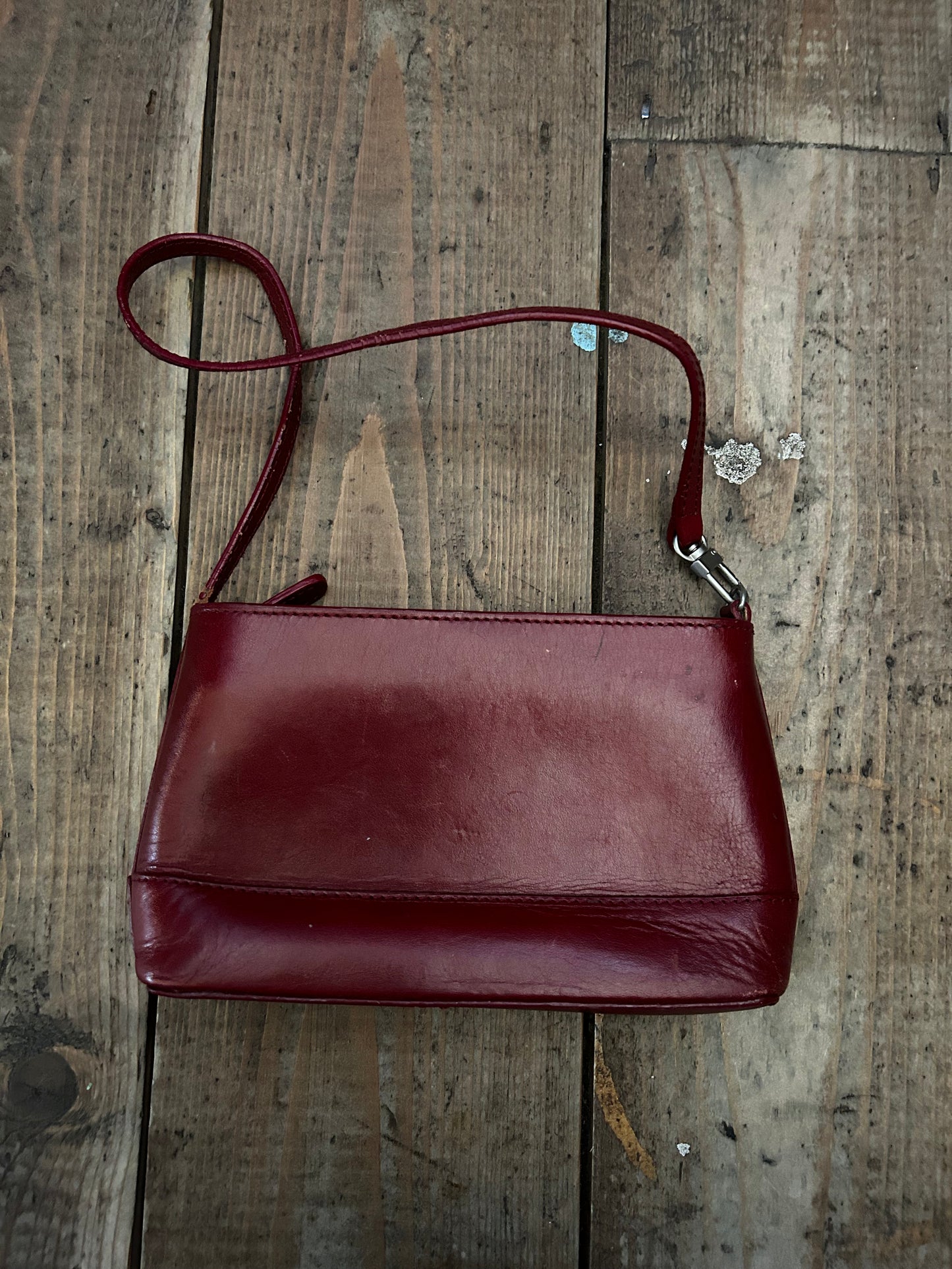 Small maroon handbag