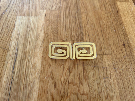 Golden geometric brooch