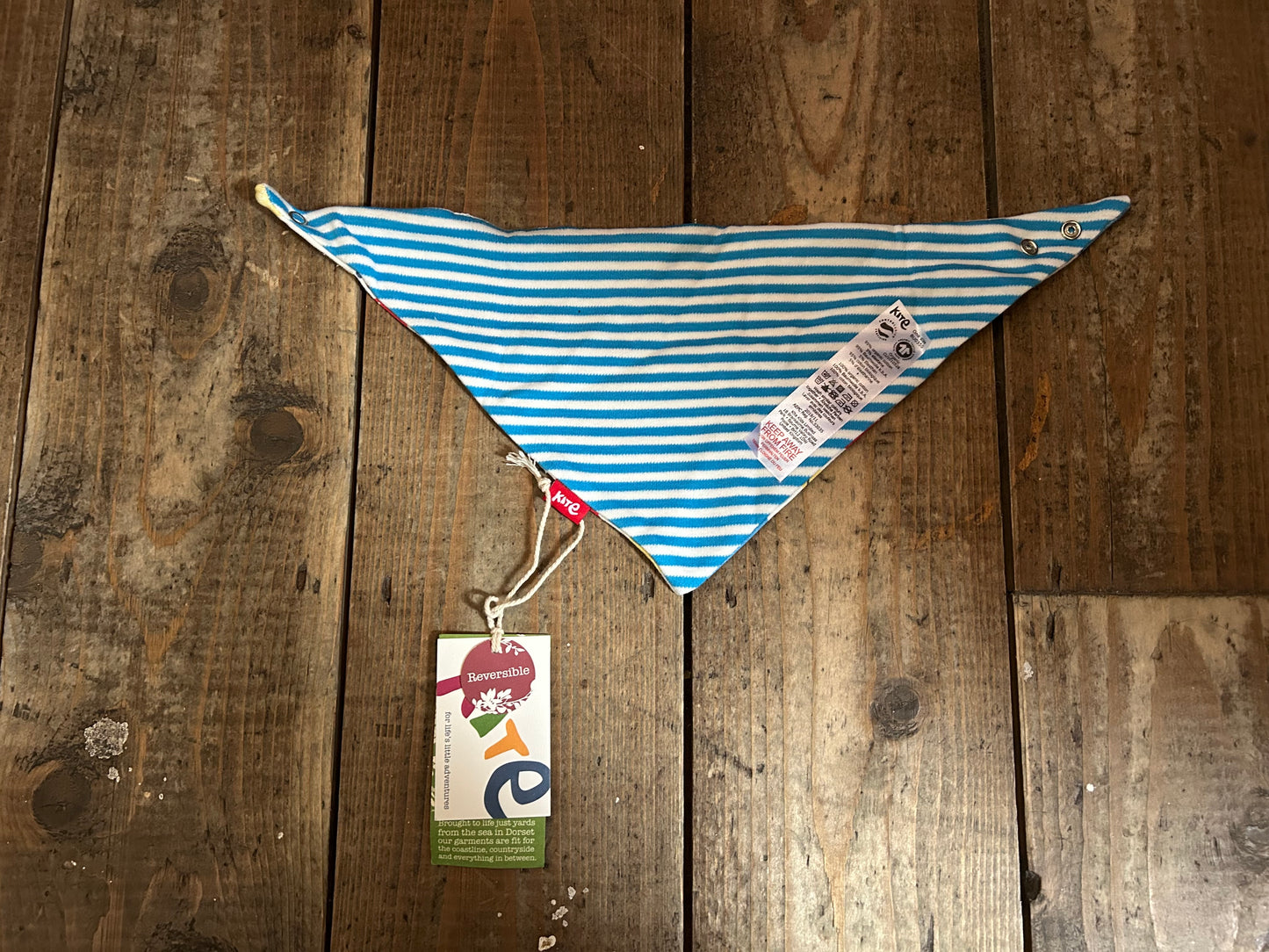 Reversible whale/stripy bib
