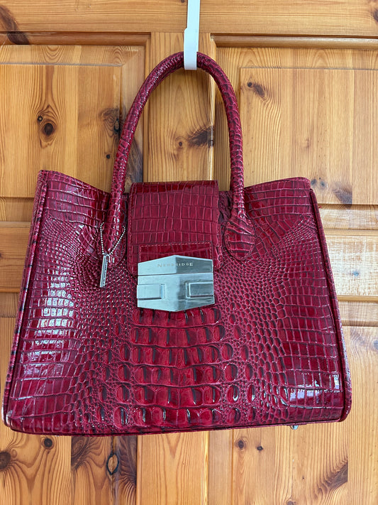 Red crocodile style handbag