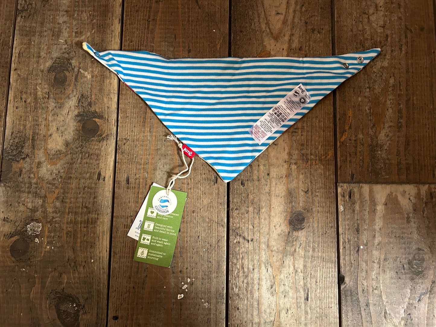 Reversible whale/stripy bib