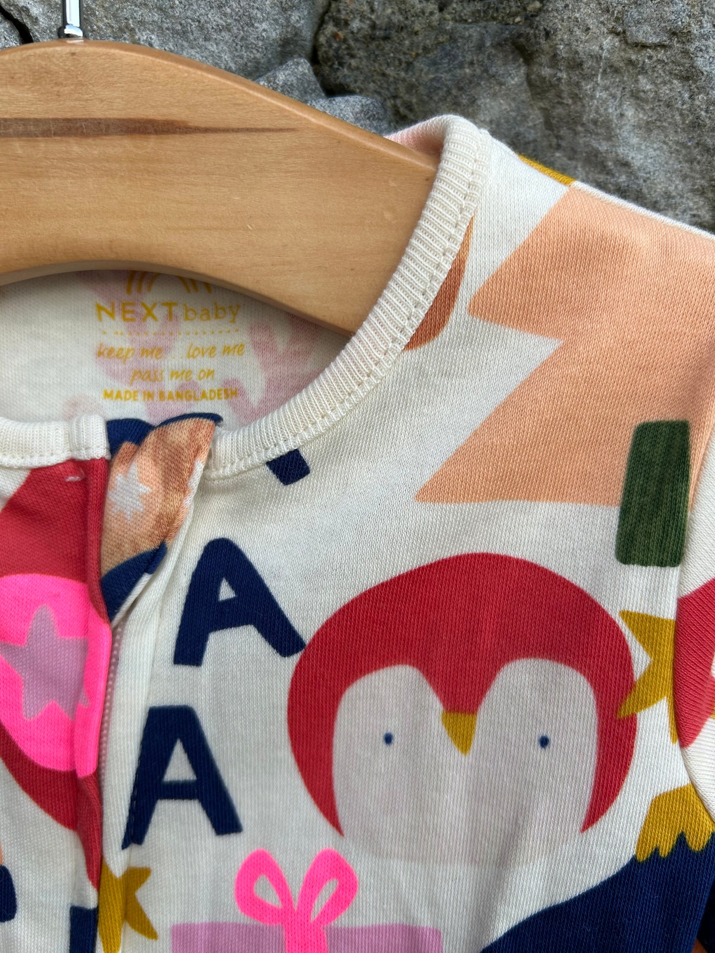 Pink festive onesie 0-3m (56-62cm)