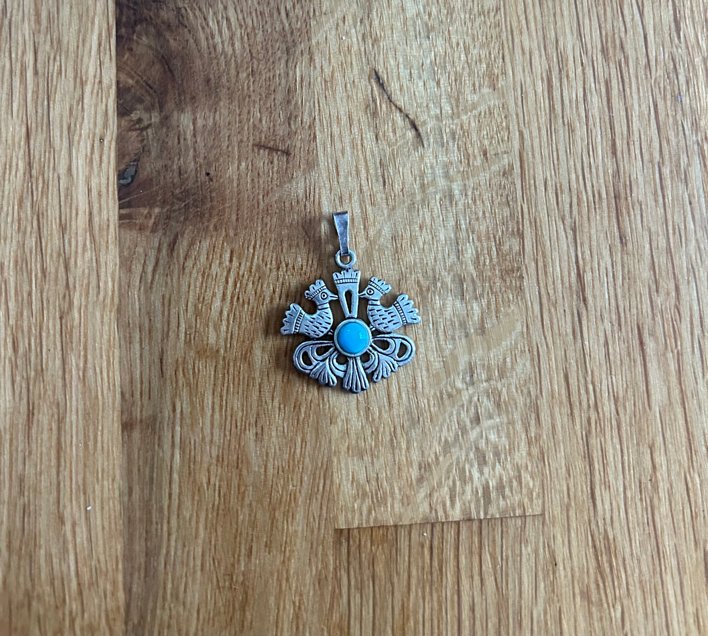 Bird’s silver pendant