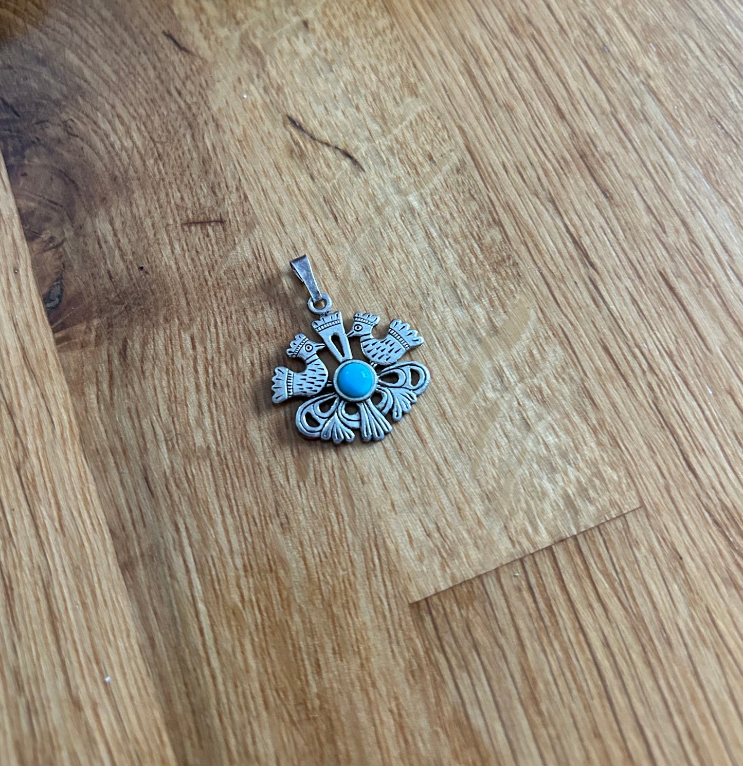 Bird’s silver pendant