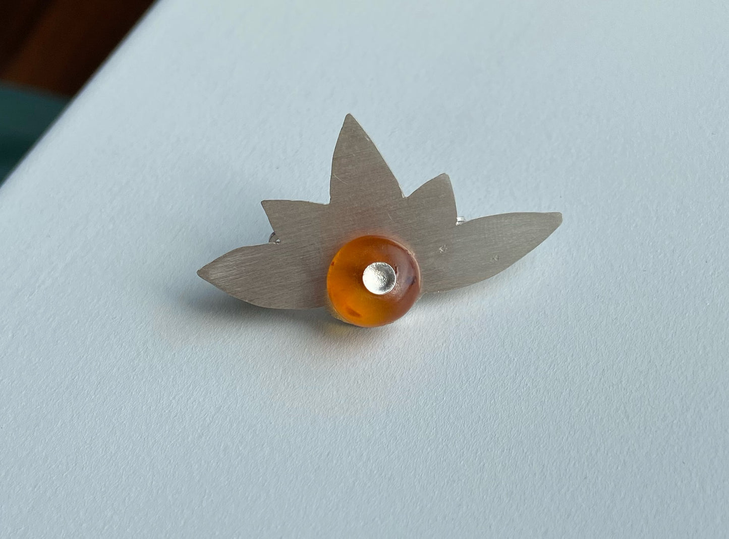 Amber and silver brooch