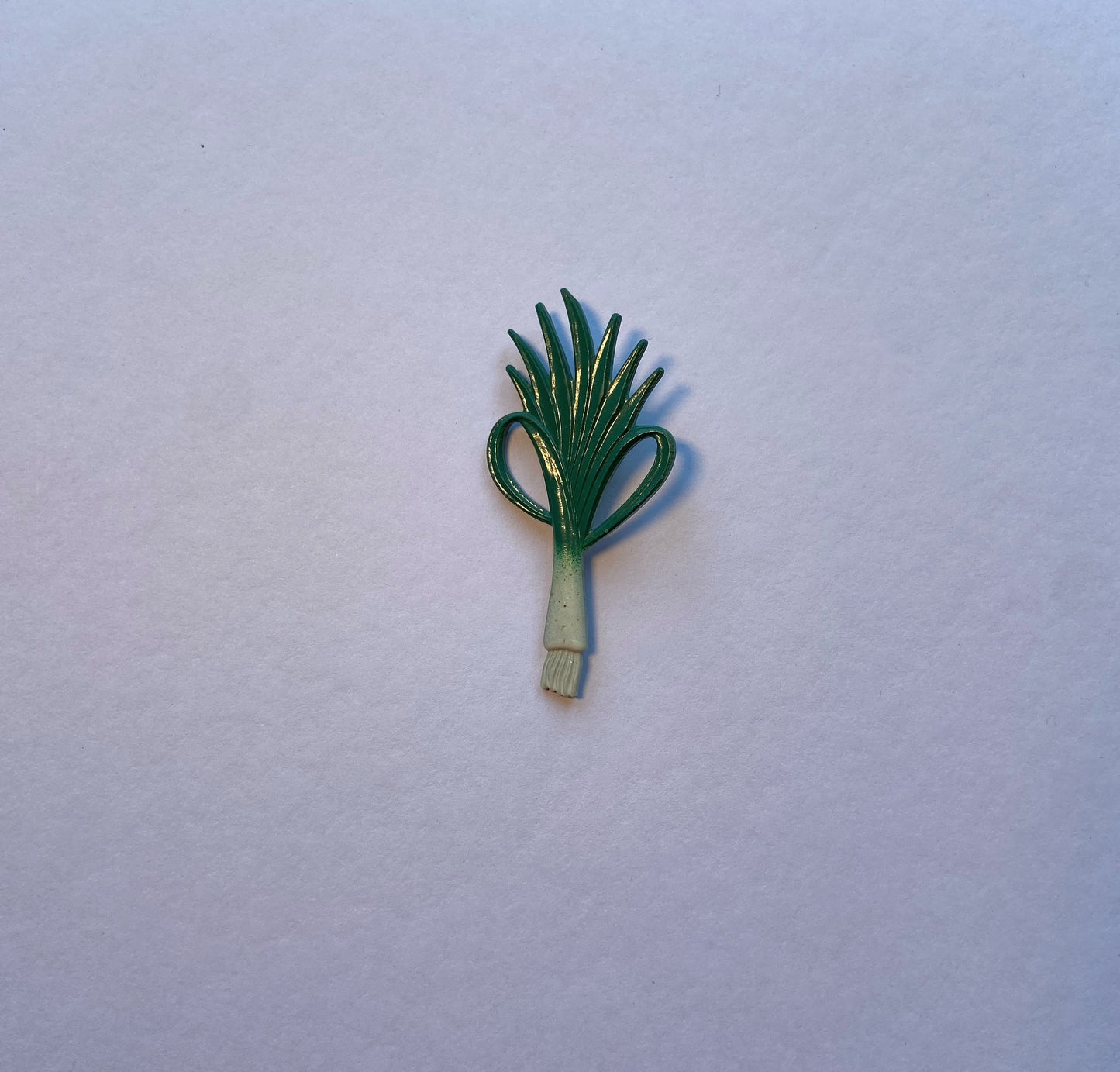 Leek brooch