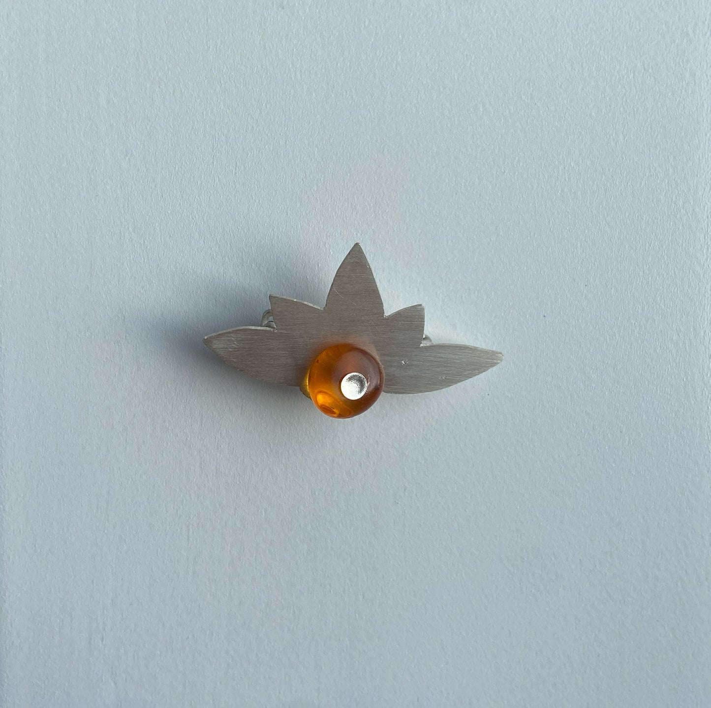 Amber and silver brooch