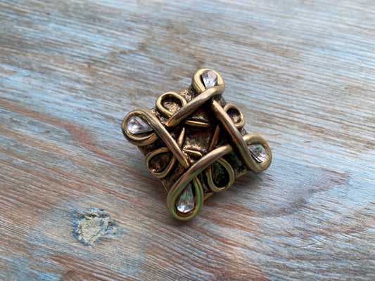 Golden square brooch