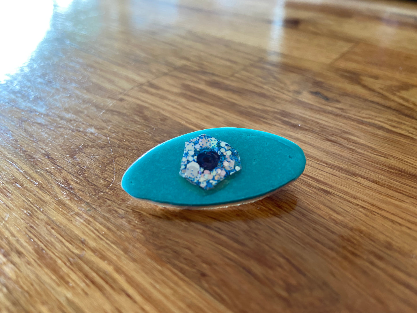 Blue eye brooch