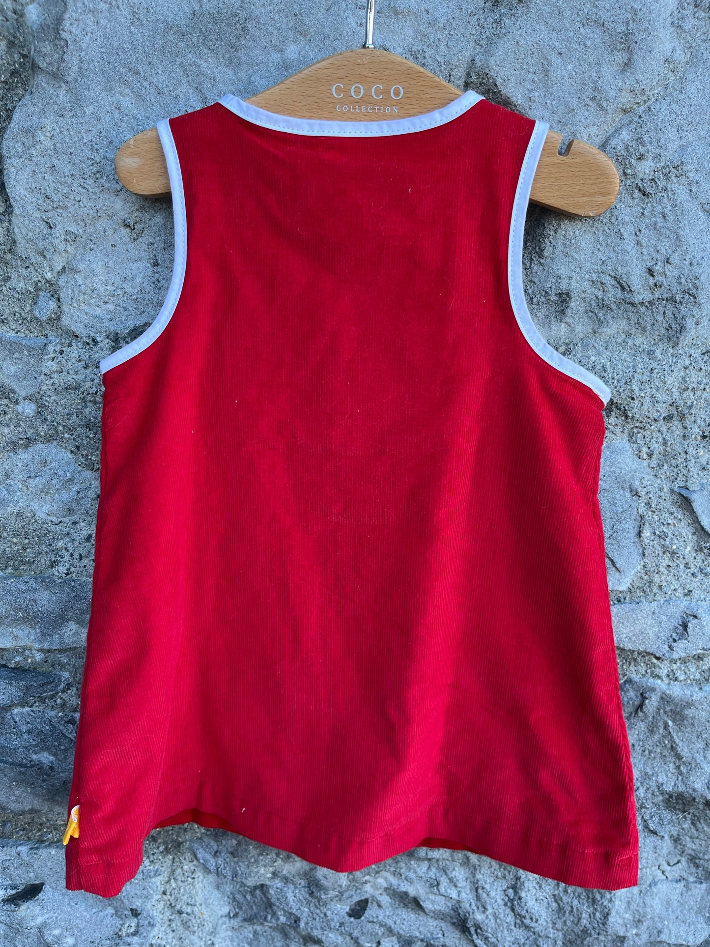 Red pinafore  0-3m (56-62cm)